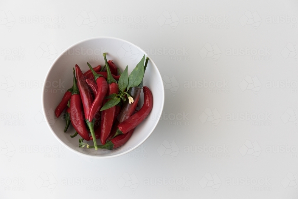 Chillis In A White Bowl - Left - Australian Stock Image