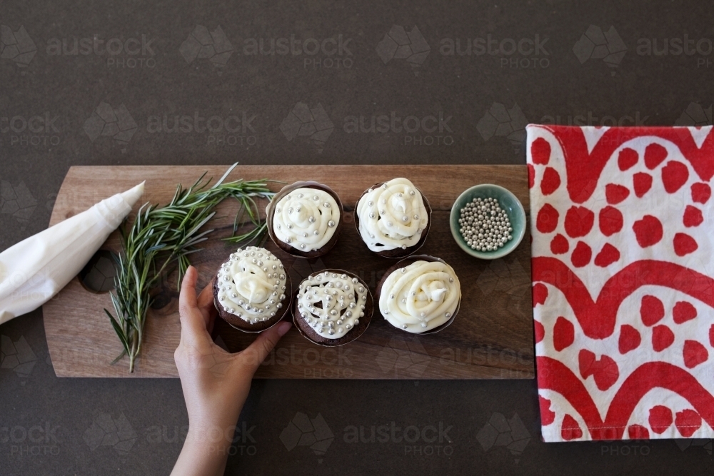 Chocolate cupcakes with white frosting - Australian Stock Image