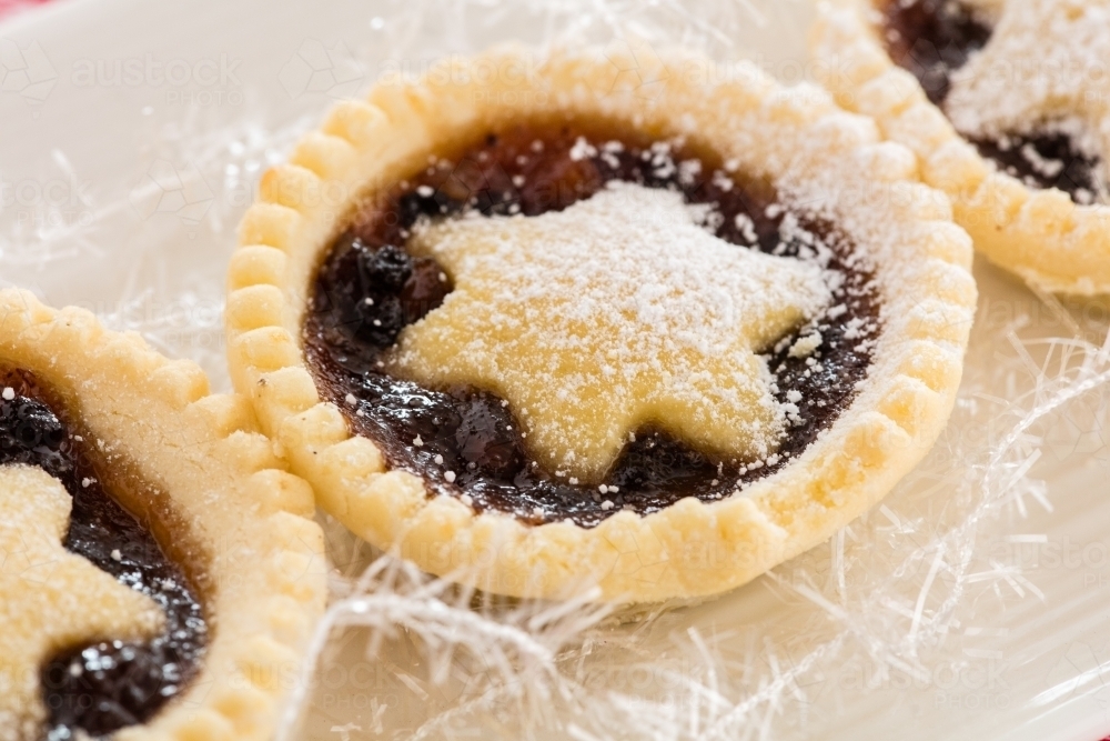 Christmas Fruit Mince Pies on a white tray with white decoration - Australian Stock Image