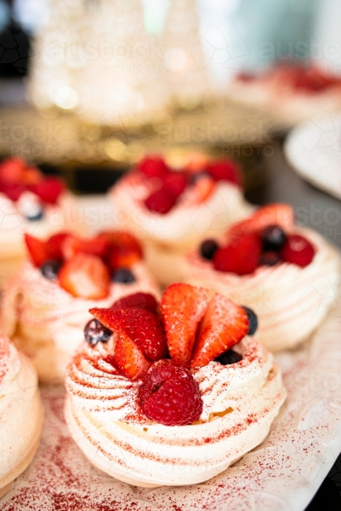 Christmas meringues with raspberry, strawberry, blueberry and cream : Austockphoto Christmas meringues with raspberry, strawberry, blueberry and cream - Australian Stock Image