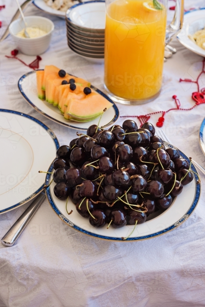 christmas morning breakfast, cherries and fruits - Australian Stock Image
