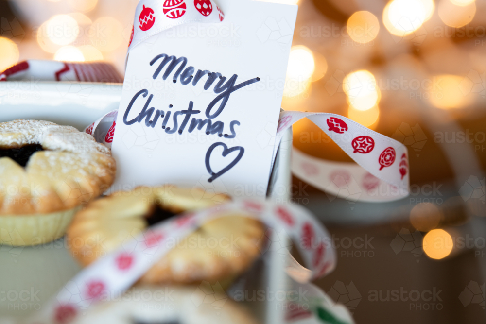 Image of christmas traditional treat, fruit mince pies with a merry ...