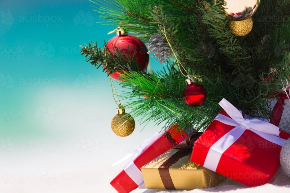 Christmas tree on a beautiful white sandy beach paradise in the summer - Australian Stock Image