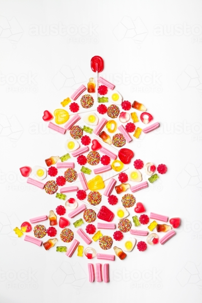 Christmas tree shape flat lay made from lollies and candy - Australian Stock Image