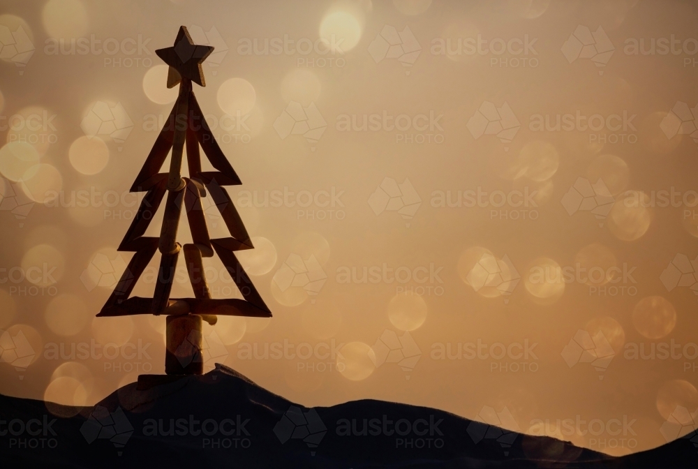 Christmas tree silhouette on beach background - Australian Stock Image