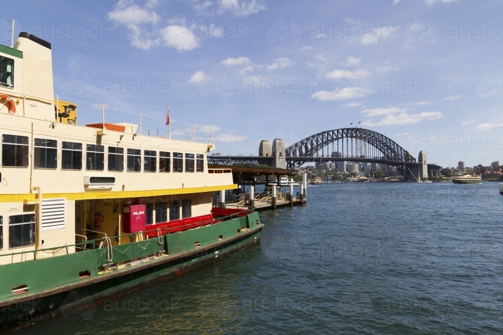 Circular Quay Sydney Harbour with NSW Transport Ferry and The Sydney Harbour Bridge in background - Australian Stock Image