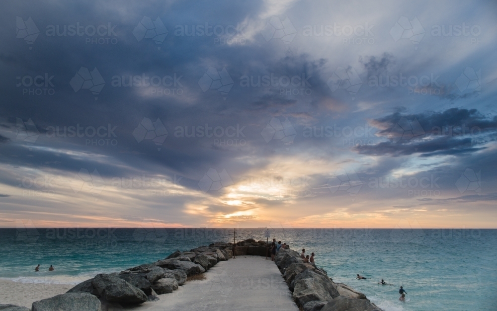 City beach groyne at dusk - Australian Stock Image