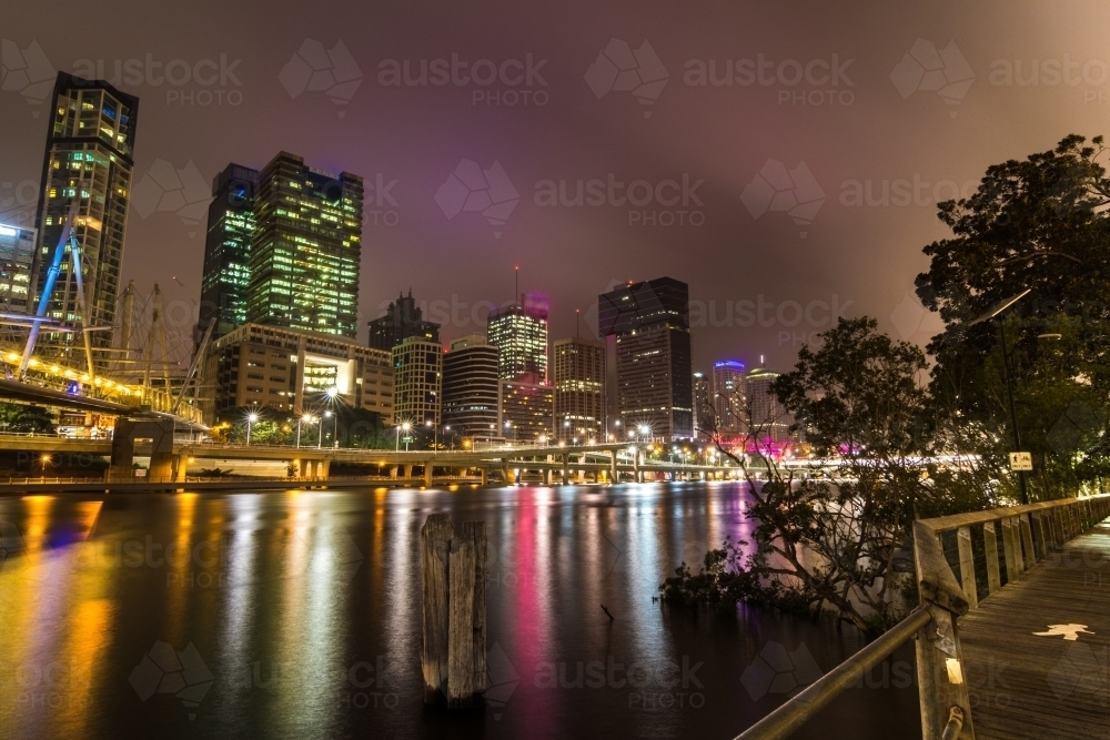 City buildings overlooking the Brisbane River at night - Australian Stock Image