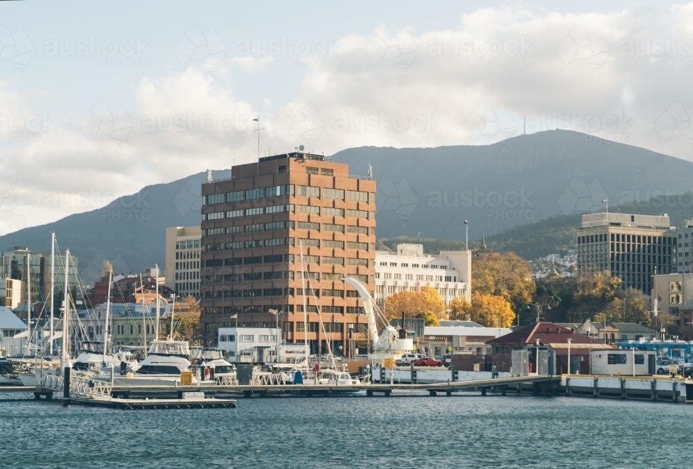 City harbour with mountain silhouette background - Australian Stock Image