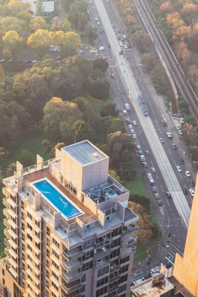 city living, view of an apartment building looking down onto the rooftop pool - Australian Stock Image