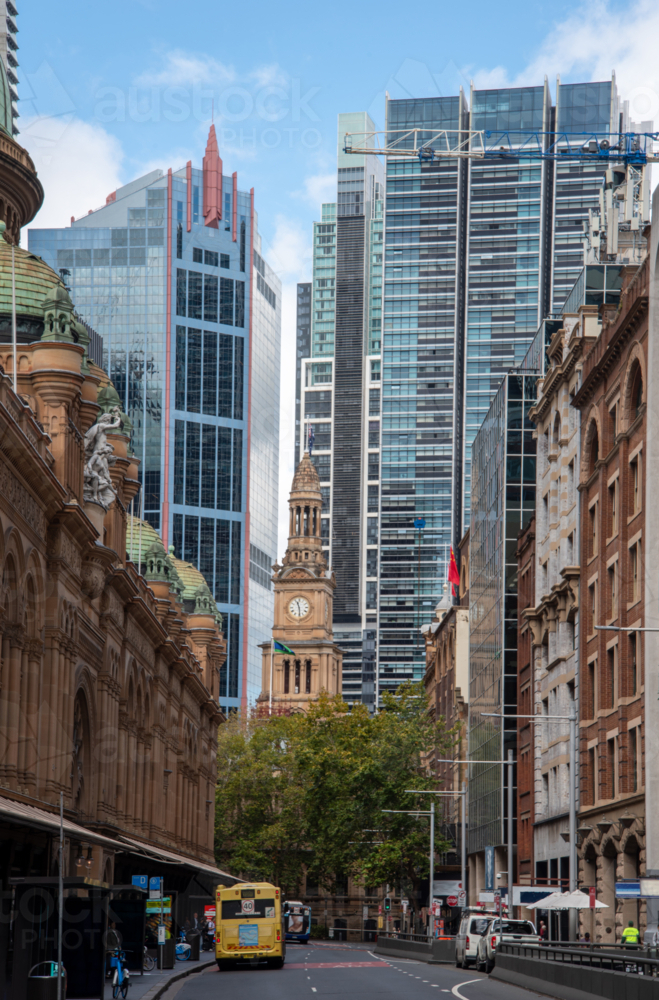 Clarence Street in Sydney with Town Hall clock tower and glass buildings behind - Australian Stock Image