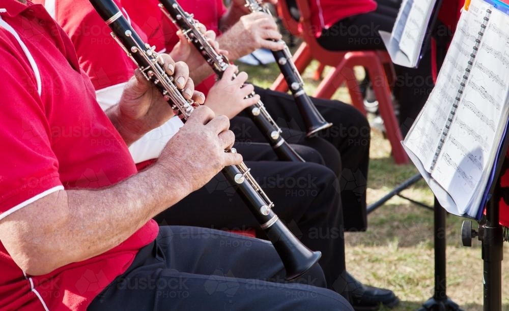 Image of players performing in an outdoor band Austockphoto