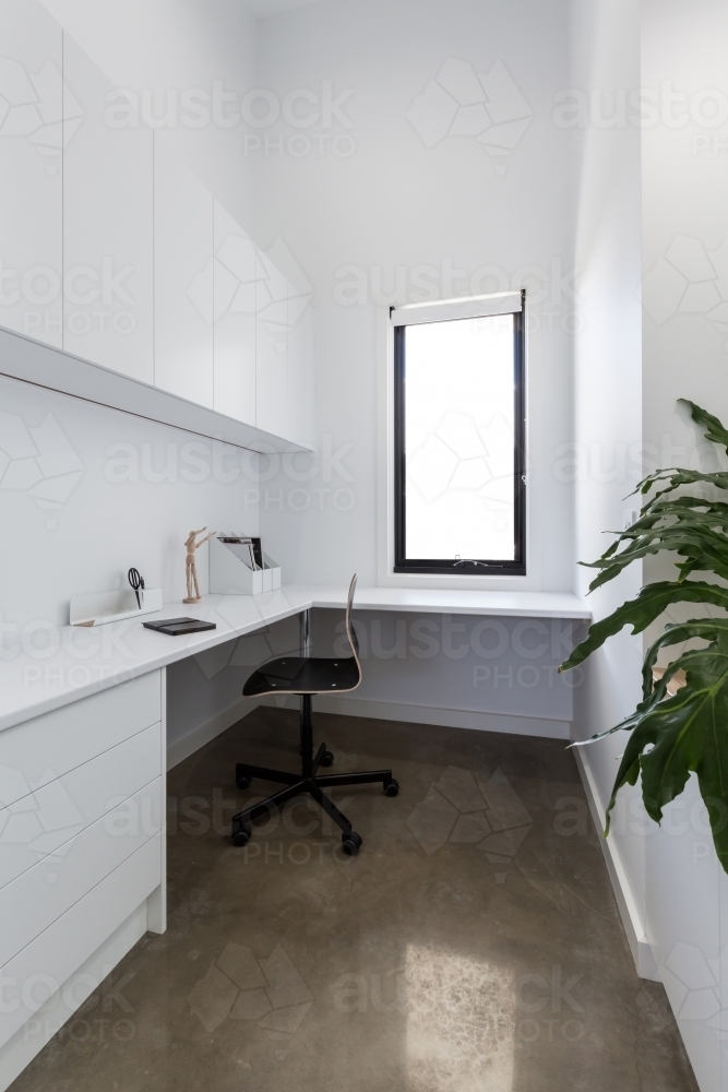 Clean crisp white study area in a contemporary home - Australian Stock Image