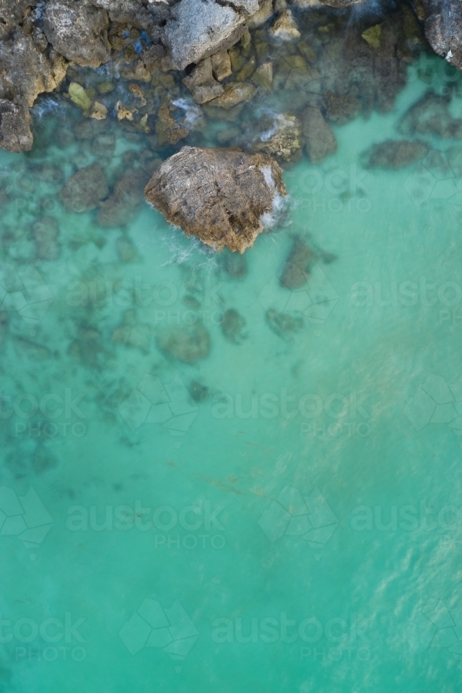 Cliff rocks in clear blue water at the Henderson limestone cliffs, near Perth, Western Australia : Austockphoto Cliff rocks in clear blue water at the Henderson limestone cliffs, near Perth, Western Australia - Australian Stock Image