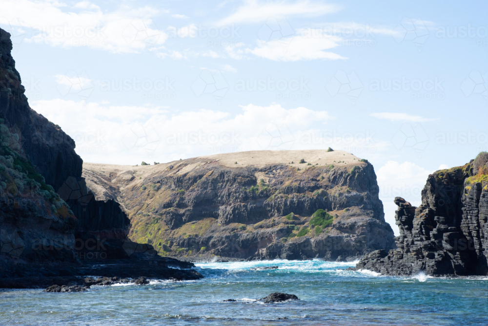 Cliffs and ocean on Mornington Peninsula on sunny day - Australian Stock Image