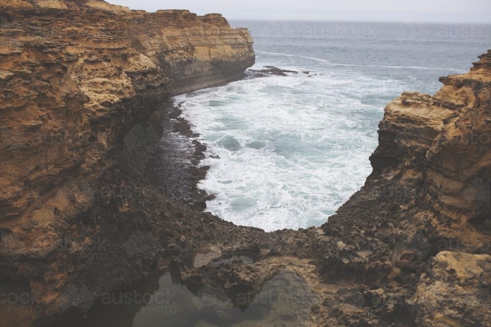 Cliffs surrounding a bay - Australian Stock Image