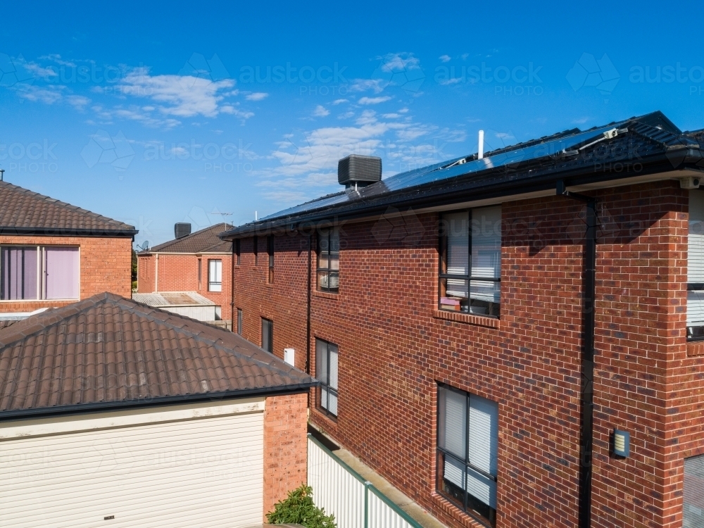 Close packed brick buildings in city suburb - Australian Stock Image