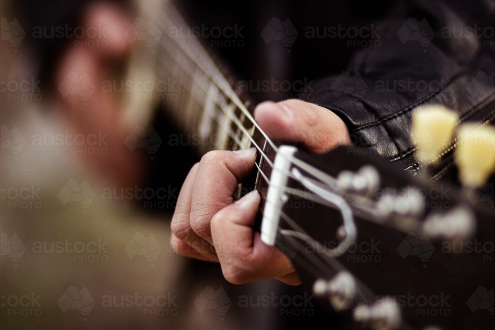 Close up detail of guitar strings and neck - Australian Stock Image