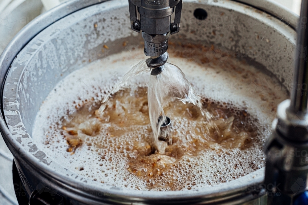 Close-up of a beer mashing procedure. - Australian Stock Image