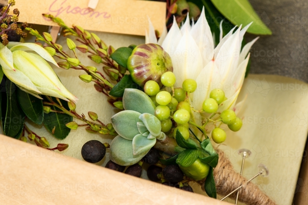 Close up of a groom's buttonhole or boutonniere ready to be packaged - Australian Stock Image