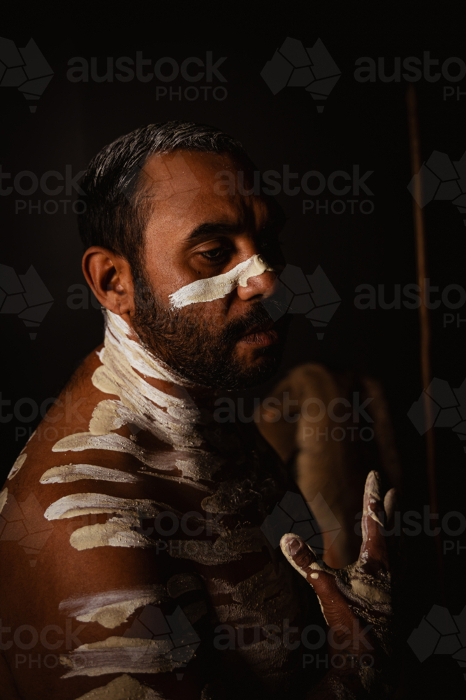 Close-up of aboriginal man with white body paint - Australian Stock Image