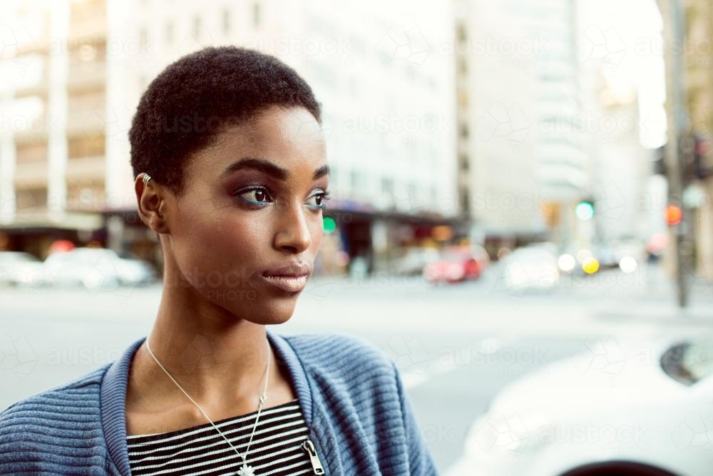 Close up of an african woman on a city street - Australian Stock Image