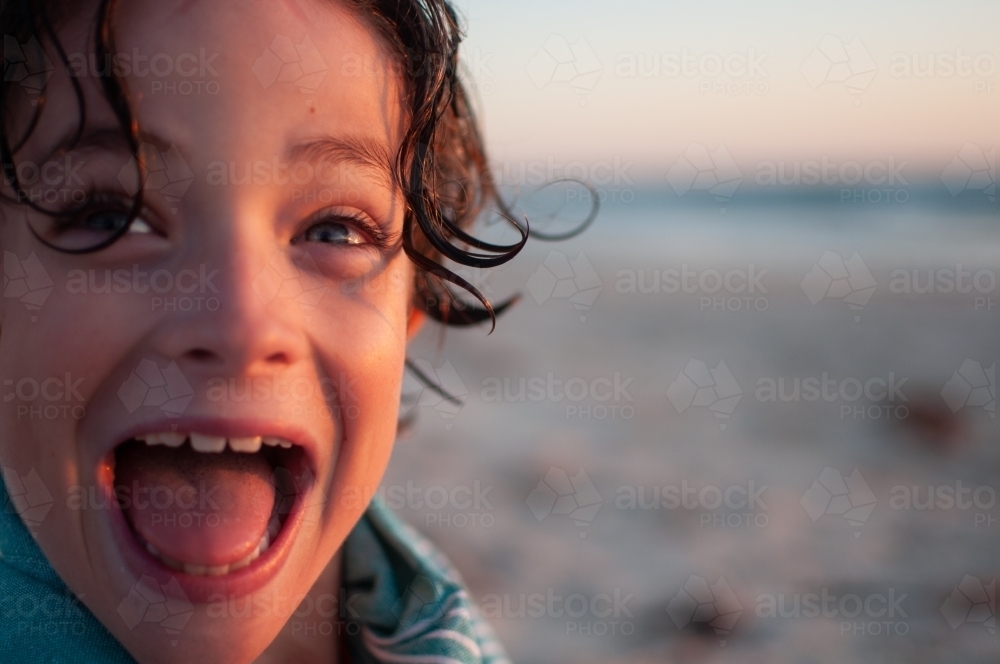 Close up of child's face at beach - Australian Stock Image