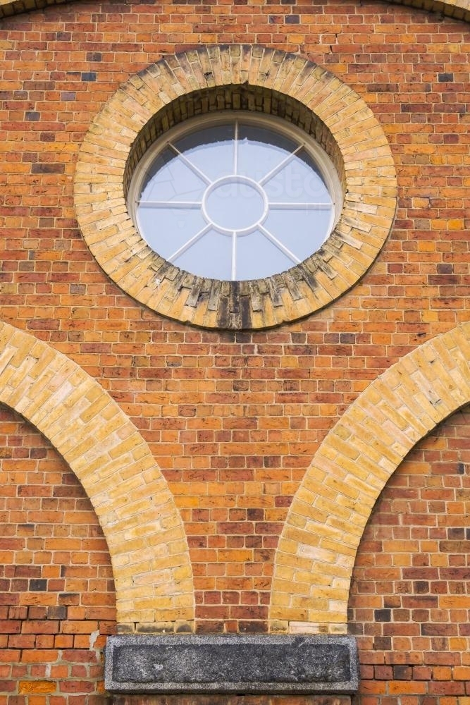 Close up of curved brickwork and circular window - Australian Stock Image
