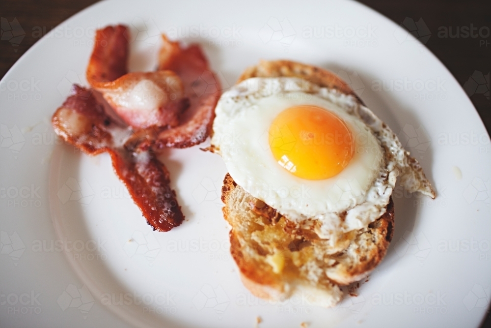 Close up of eggs and bacon and toast for breakfast - Australian Stock Image