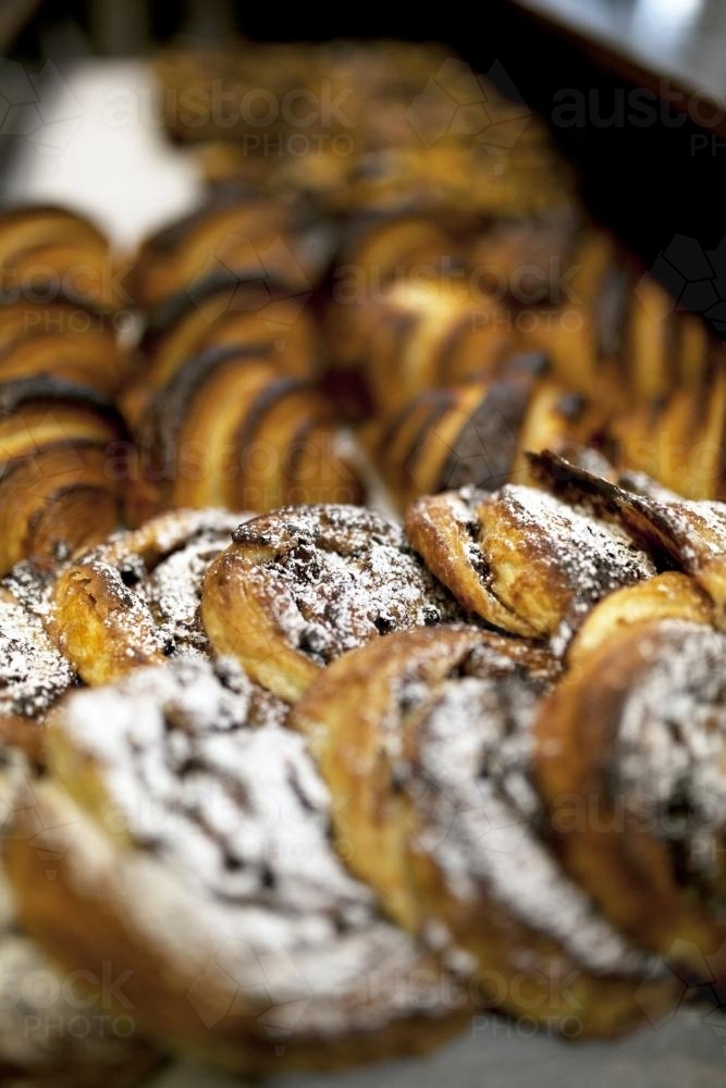 Close up of freshly made pastries at a bakery cafe - Australian Stock Image
