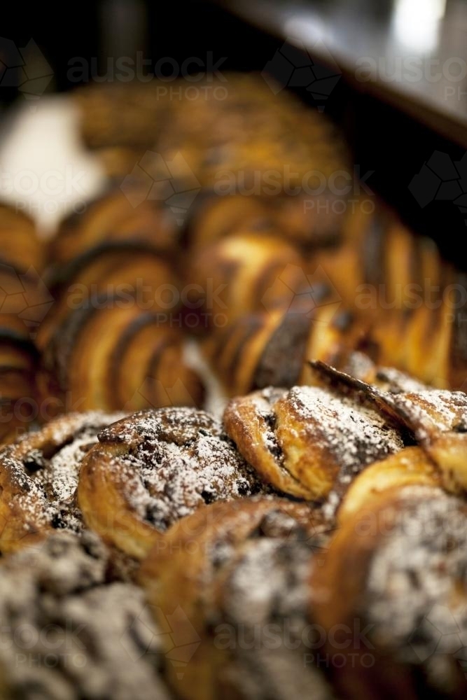 Close up of freshly made pastries at a bakery cafe - Australian Stock Image