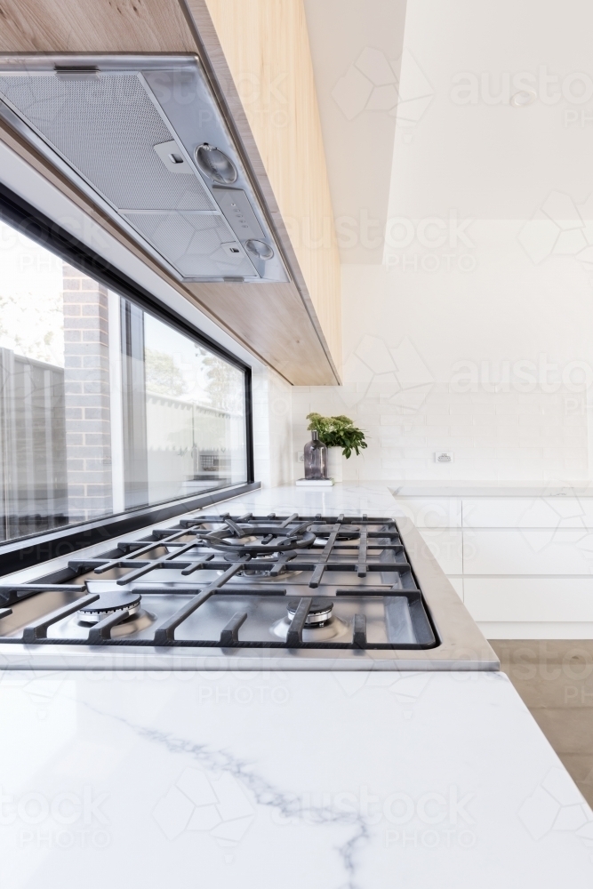 Close up of gas cooktop in a contemporary new kitchen - Australian Stock Image