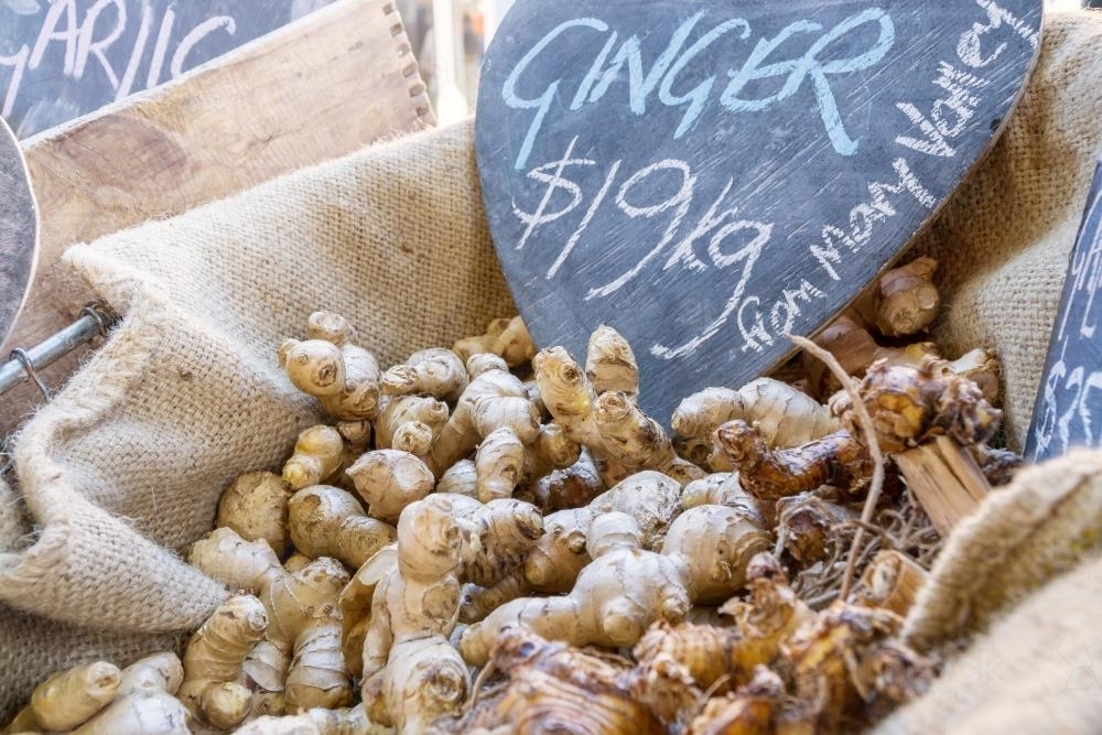 Close up of ginger for sale in a hessian lined basket - Australian Stock Image