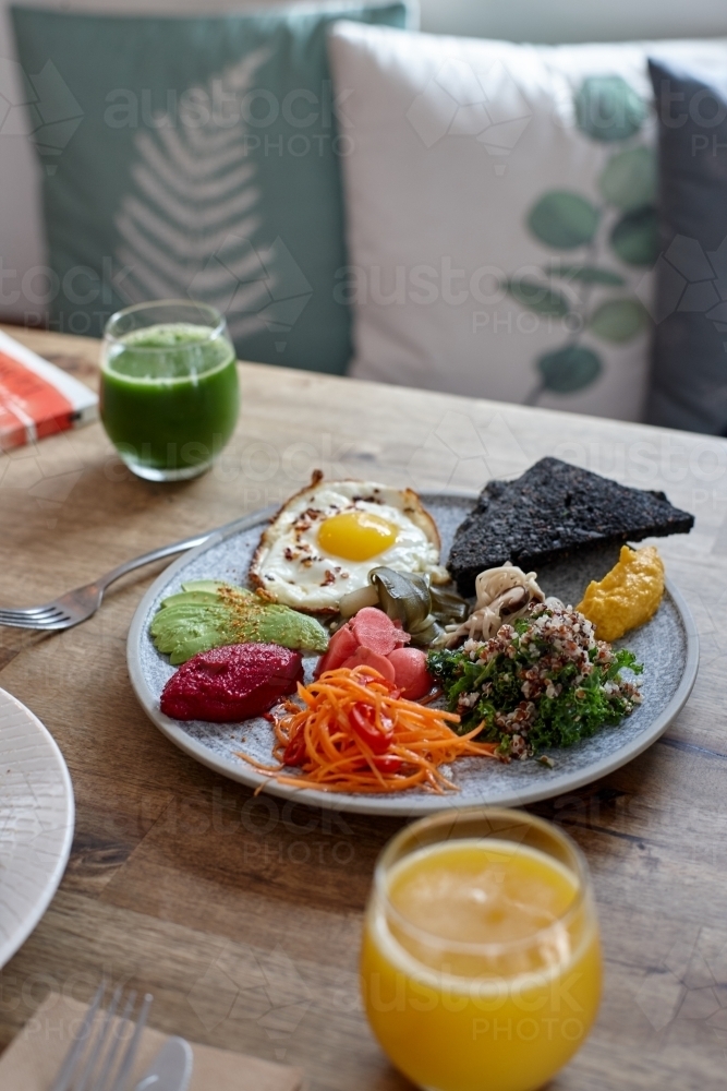 Close-up of healthy vegetarian meal on wooden table - Australian Stock Image