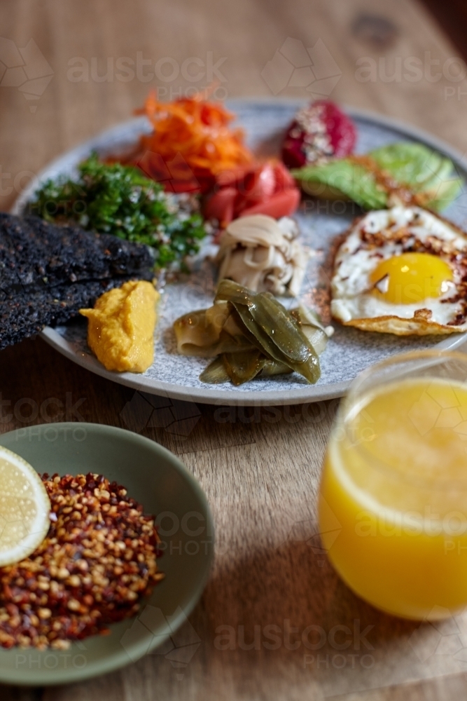 Close-up of healthy vegetarian meal on wooden table - Australian Stock Image