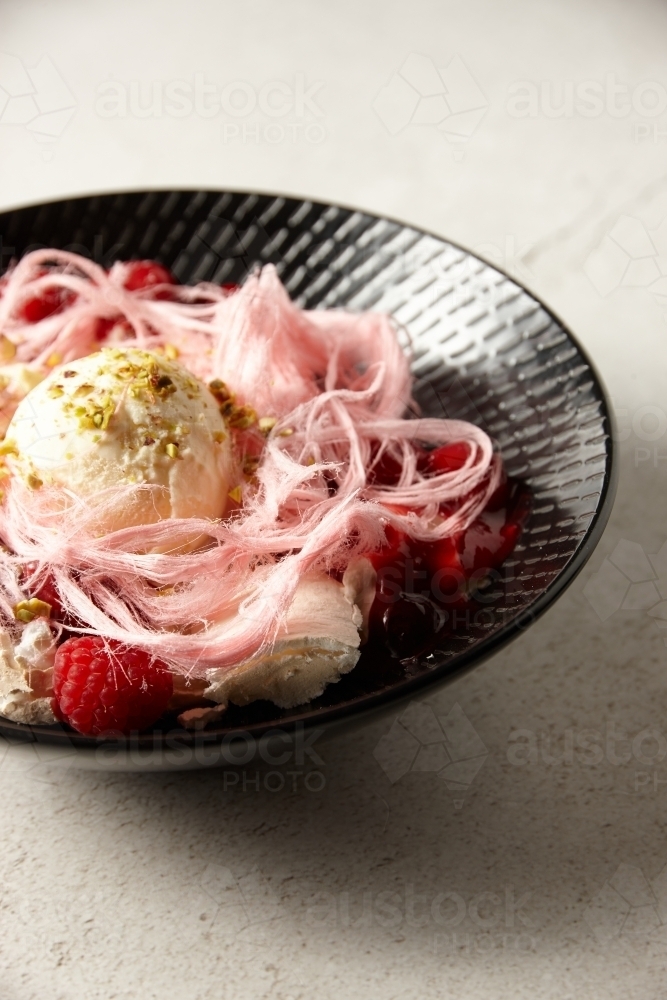 Close up of ice cream and fairy floss dessert - Australian Stock Image