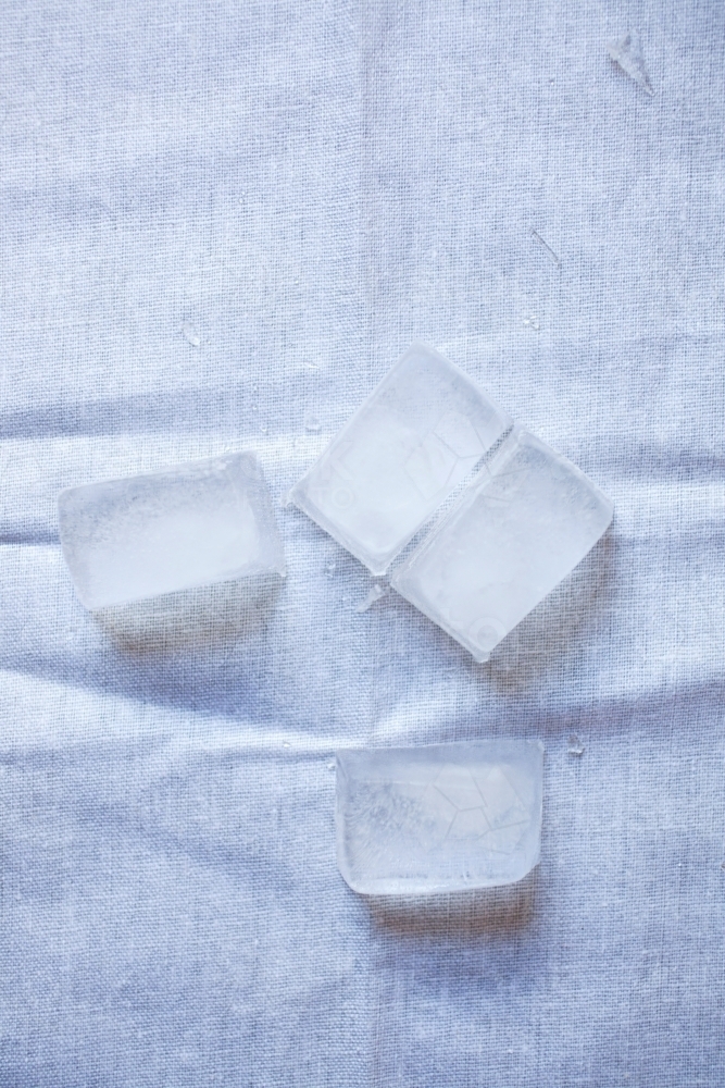 close up of ice on a table cloth - Australian Stock Image