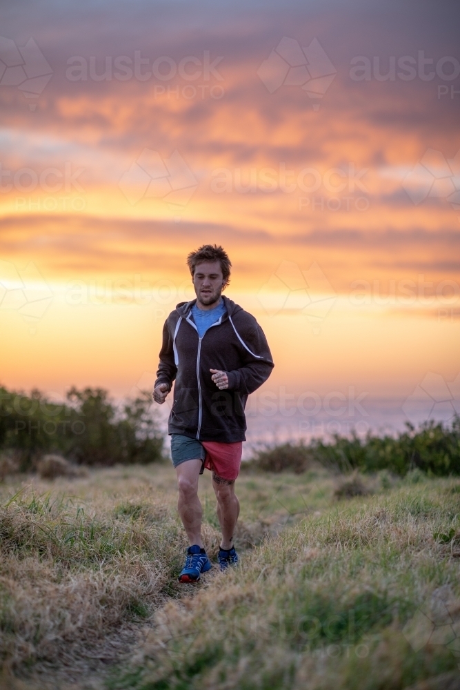Close Up of Man Running at Sunrise - Australian Stock Image