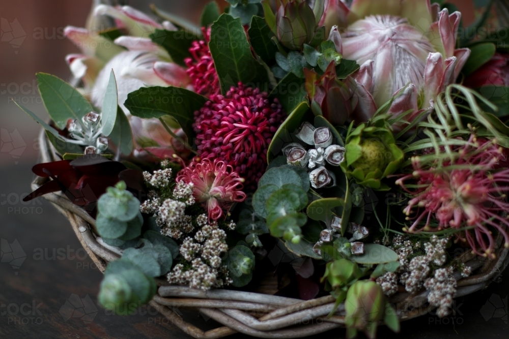 Close up of native floral arrangement in a wicker basket - Australian Stock Image