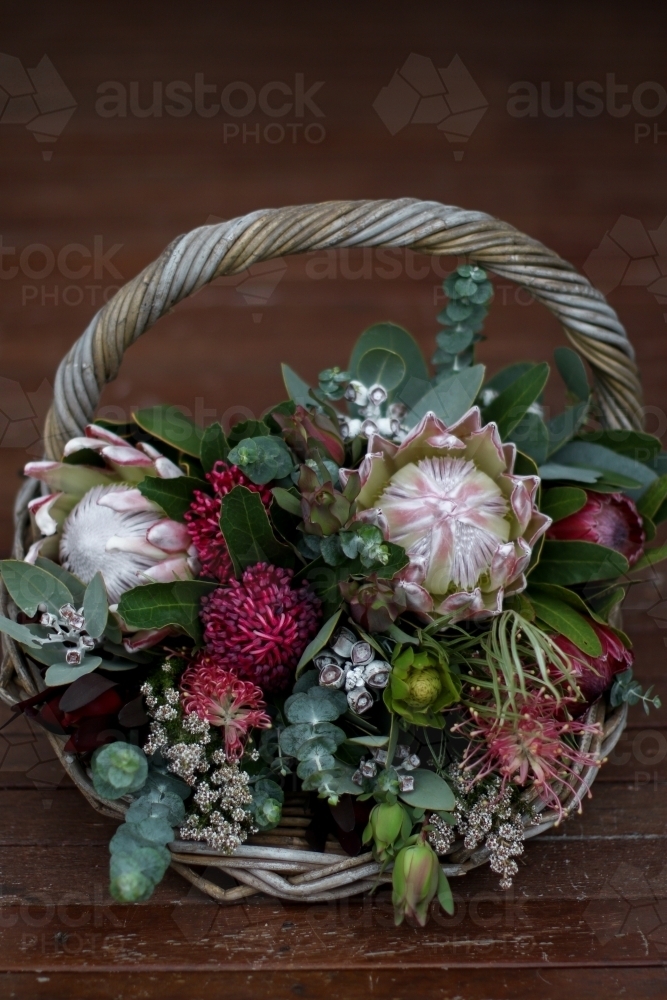 Close up of native floral arrangement in a wicker basket - Australian Stock Image