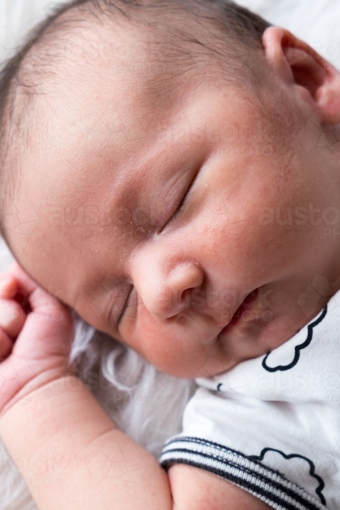 Close up of Newborn sleeping in neutral tones - Australian Stock Image