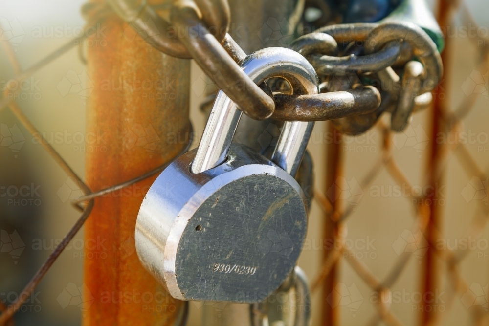Close up of padlock on gate - Australian Stock Image