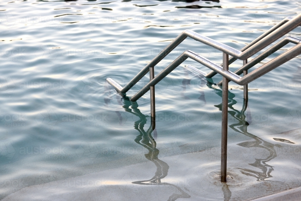 Close-up of sea pool and railings on dusk - Australian Stock Image