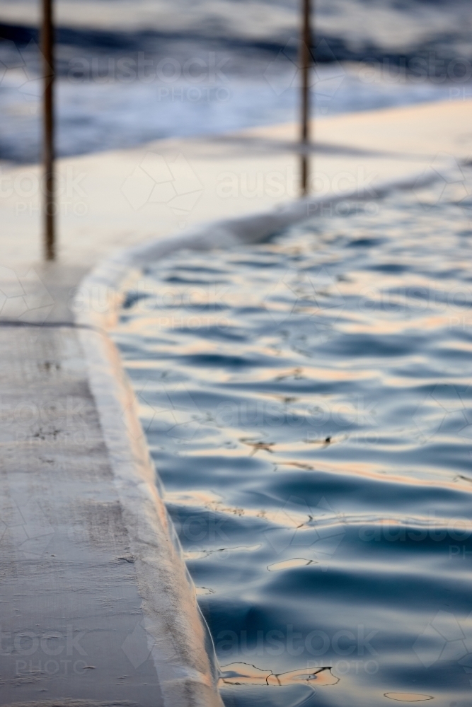 Close-up of sea pool and railings on dusk - Australian Stock Image