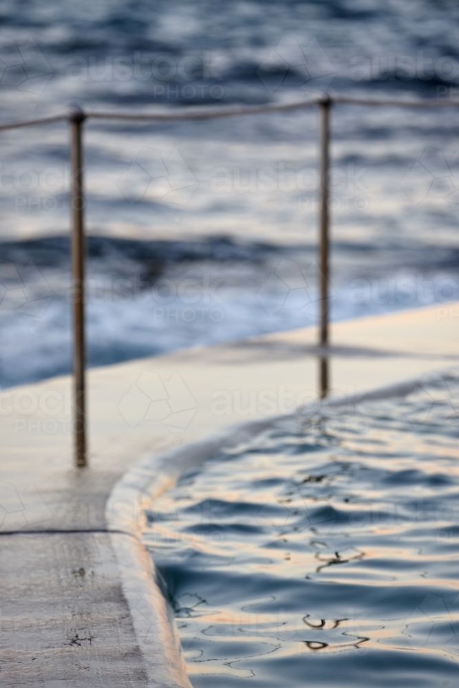 Close-up of sea pool and railings on dusk - Australian Stock Image