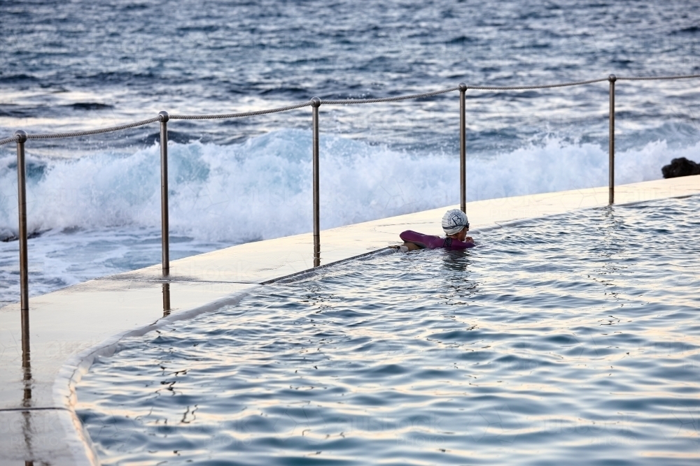 Close-up of sea pool and railings on dusk - Australian Stock Image