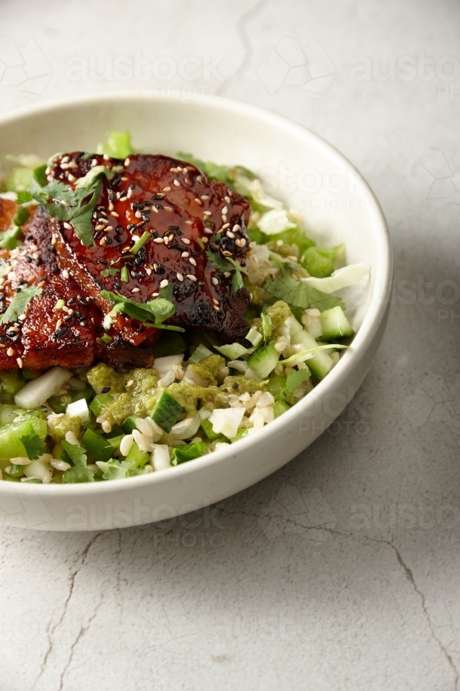 Close up of seared eggplant with brown rice salad dish - Australian Stock Image