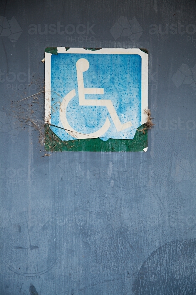 Close up of signs on public restroom toilet doors - disabled access - Australian Stock Image