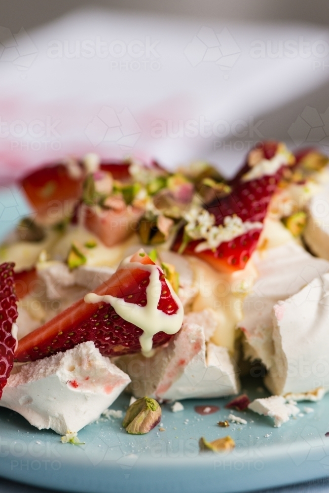 close up of strawberries on top of a pavlova, focus on the strawberry - Australian Stock Image