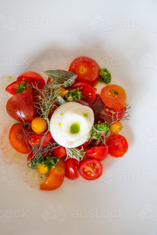Close up of tomato salad with dressing - vertical - Australian Stock Image